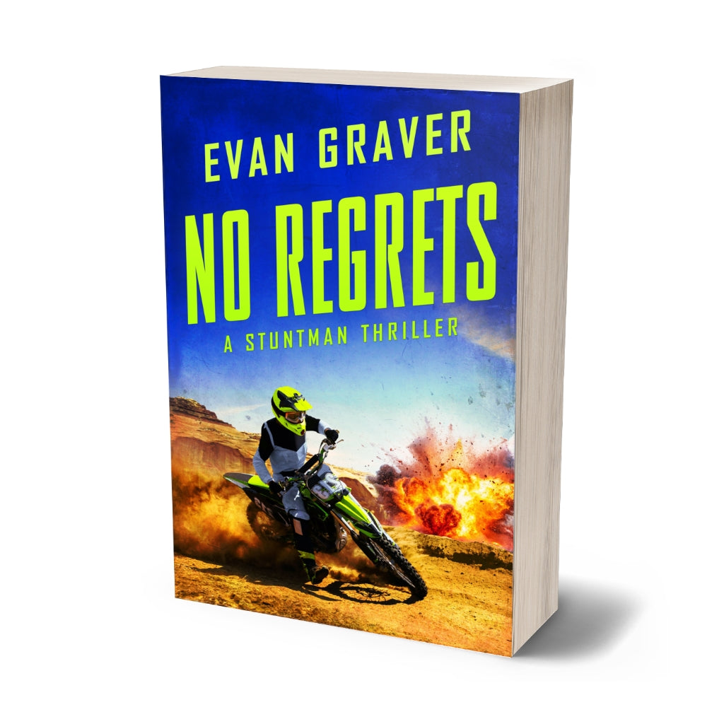Book titled 'No Regrets' by Evan Graver with a stuntman on a motorcycle against a fiery background.