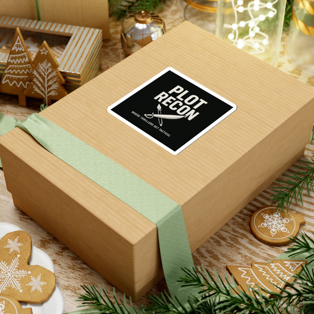 Wooden gift box with a 'Plot Recon' sticker on a festive background with cookies and greenery.