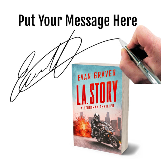 Book titled 'LA Story' by Evan Graver with a hand holding a pen and signature overlay.