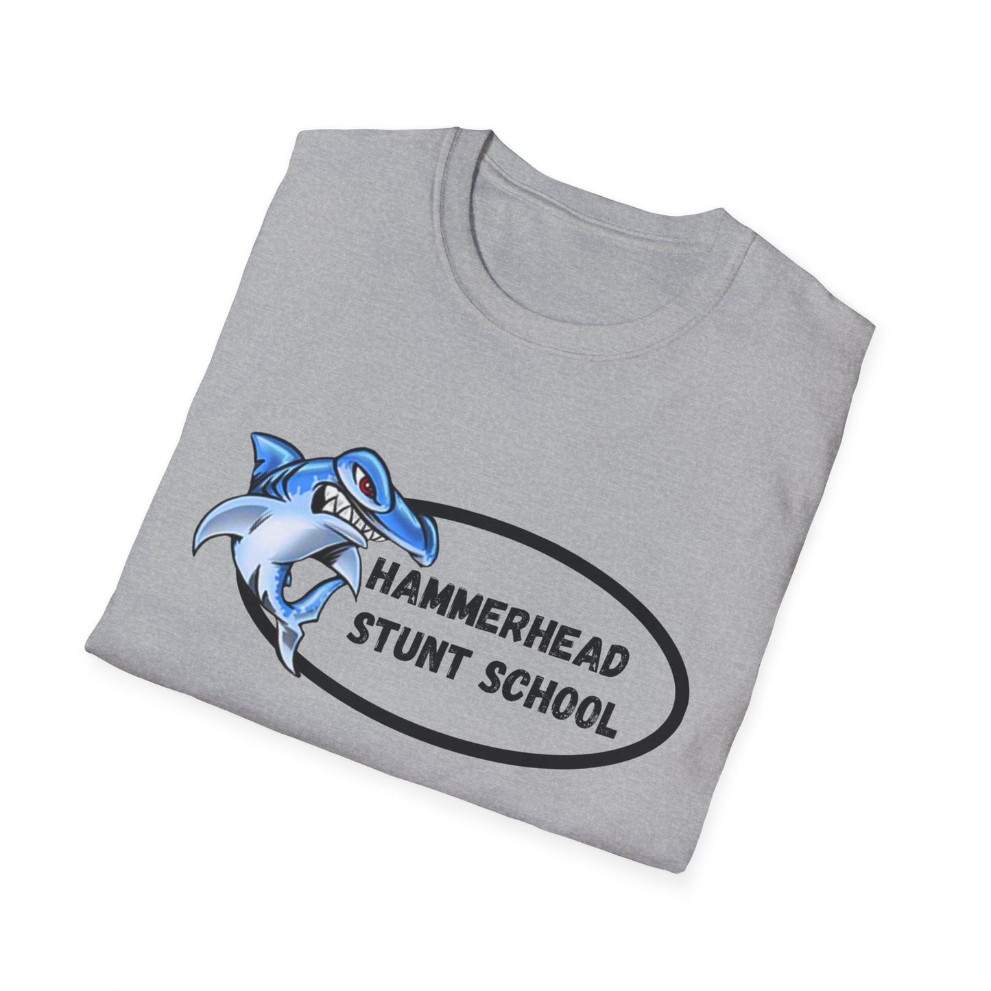 Folded gray t-shirt with a blue shark graphic and 'Hammerhead Stunt School' text on a white background