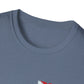 Close-up of a blue t-shirt with a small red and white logo on a white background