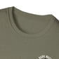 Close-up of a green t-shirt with 'Dark Water' logo on a white background