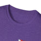 Close-up of a purple shirt with a small red and white logo on a white background