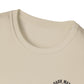 Close-up of a beige t-shirt with a logo on a white background