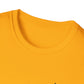 Close-up of a yellow t-shirt with a brand logo on a white background